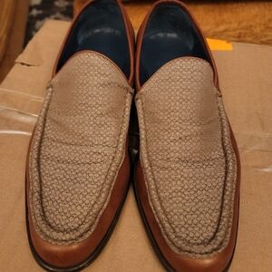 This is a pair of vintage Coach Elijah men's monogram dress loafers in brown